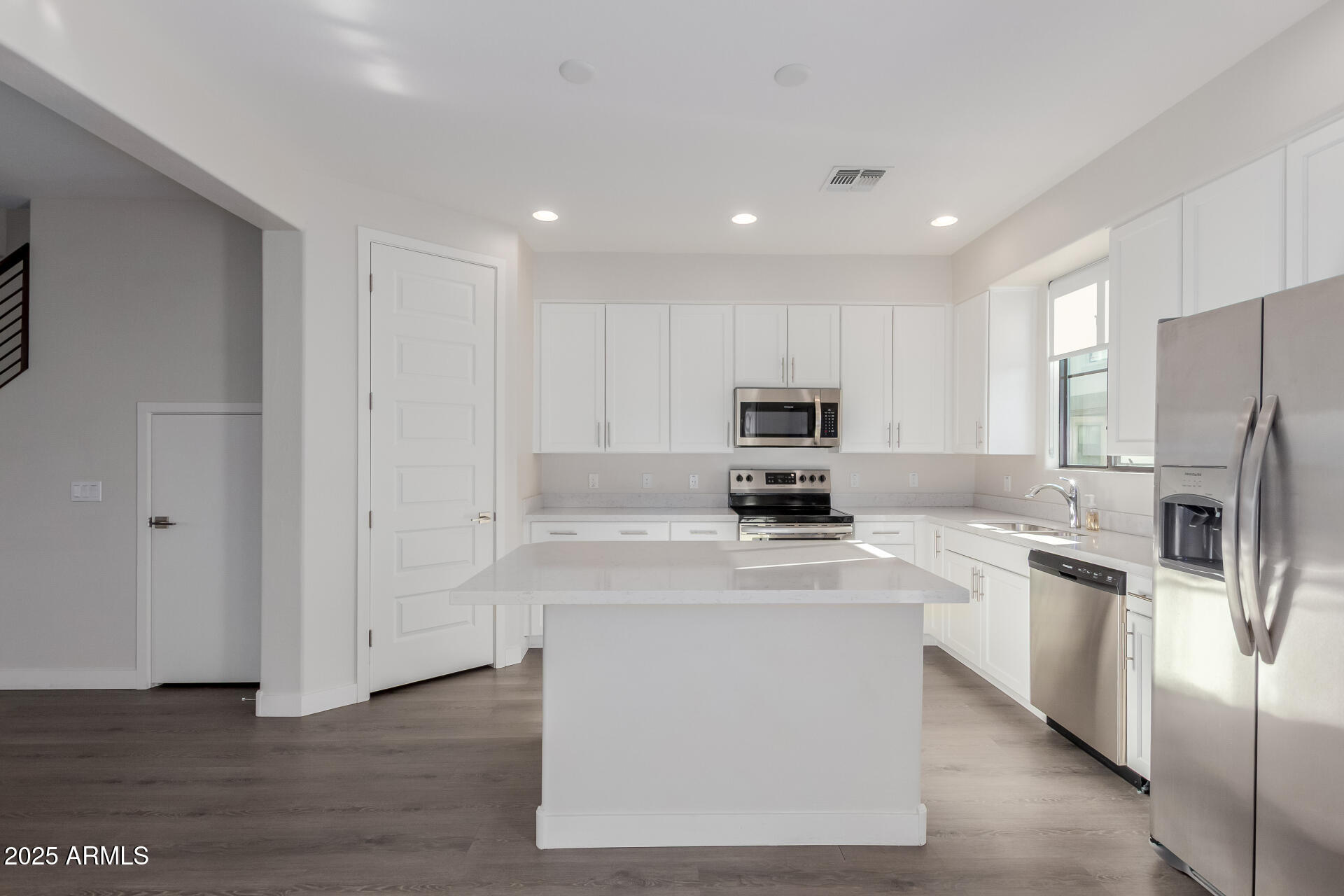 4235 North 26th Street, Unit 1 Phoenix, AZ 85016 - Photo 14 of 62 a kitchen with stainless steel appliances a refrigerator stove microwave and sink
