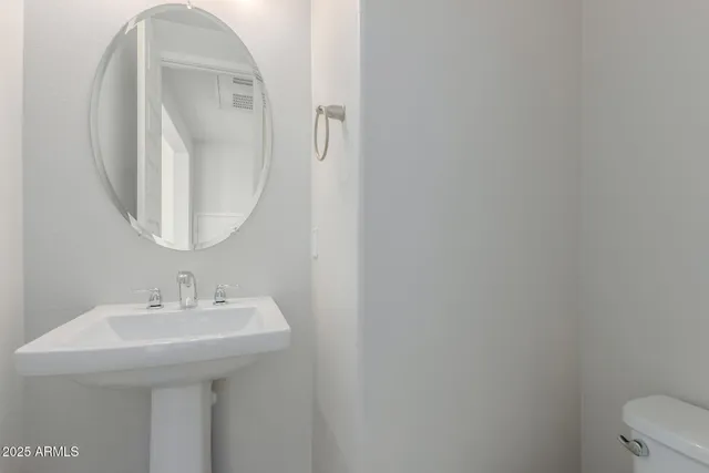 a kitchen with appliances a sink and cabinets