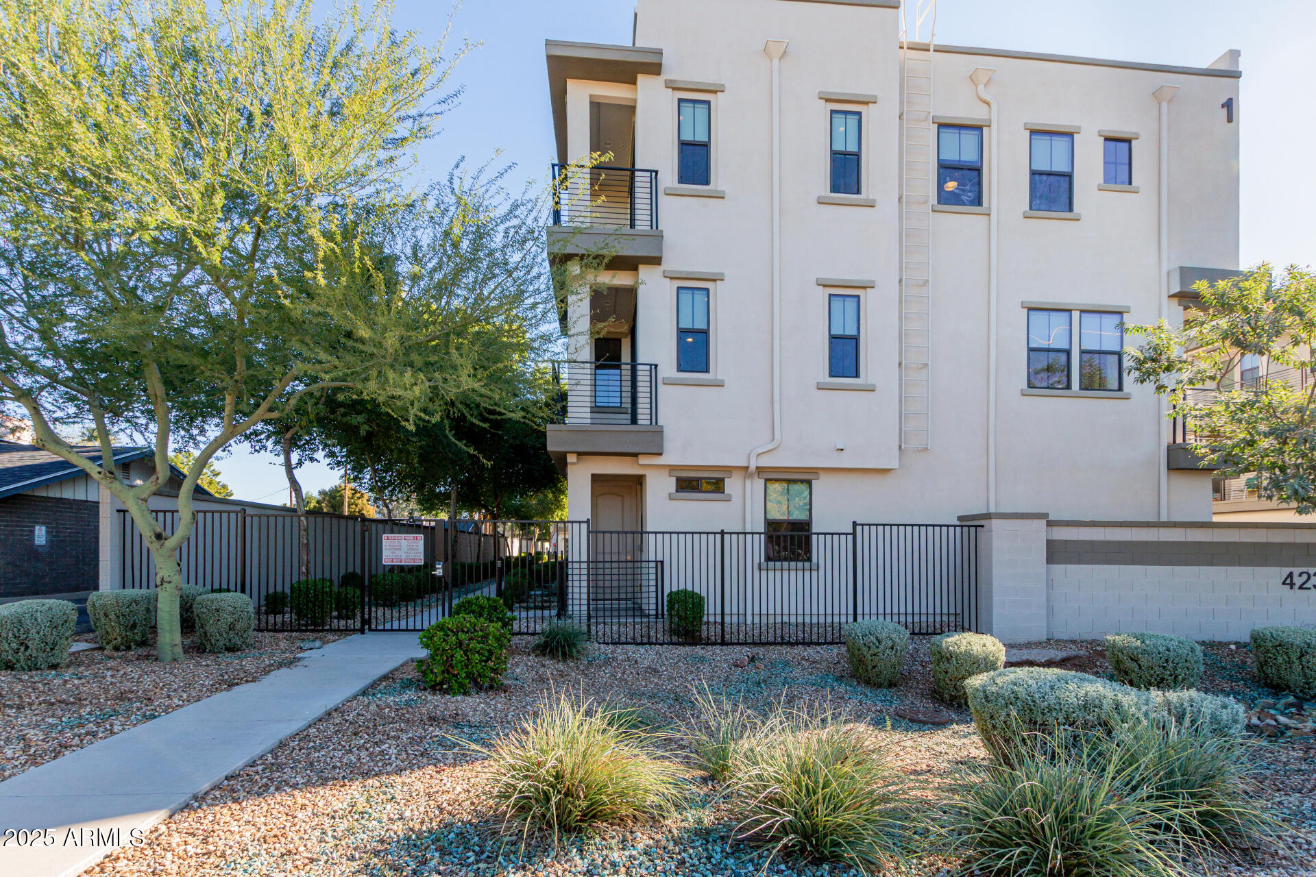 4235 North 26th Street, Unit 1 Phoenix, AZ 85016 - Photo 2 of 62 a front view of a house with garden