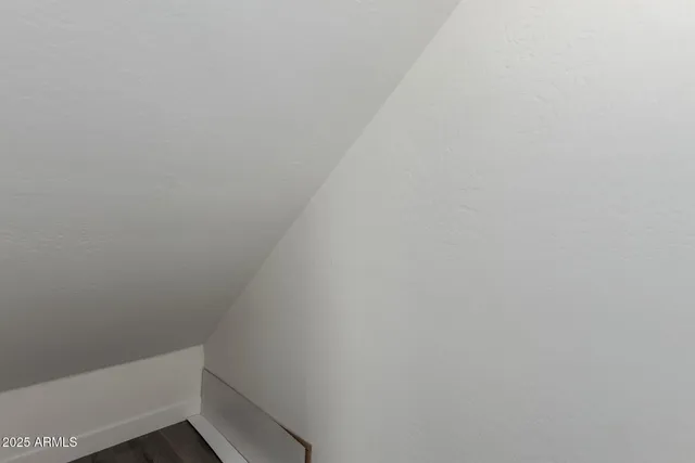 a room that has a bed and a chair in it