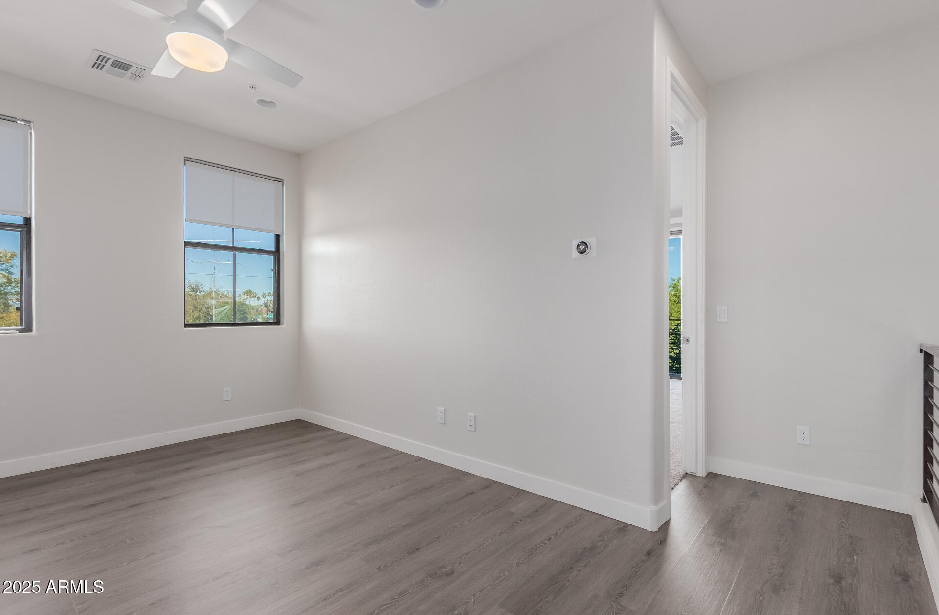 4235 North 26th Street, Unit 1 Phoenix, AZ 85016 - Photo 35 of 62 an empty room with wooden floor and windows
