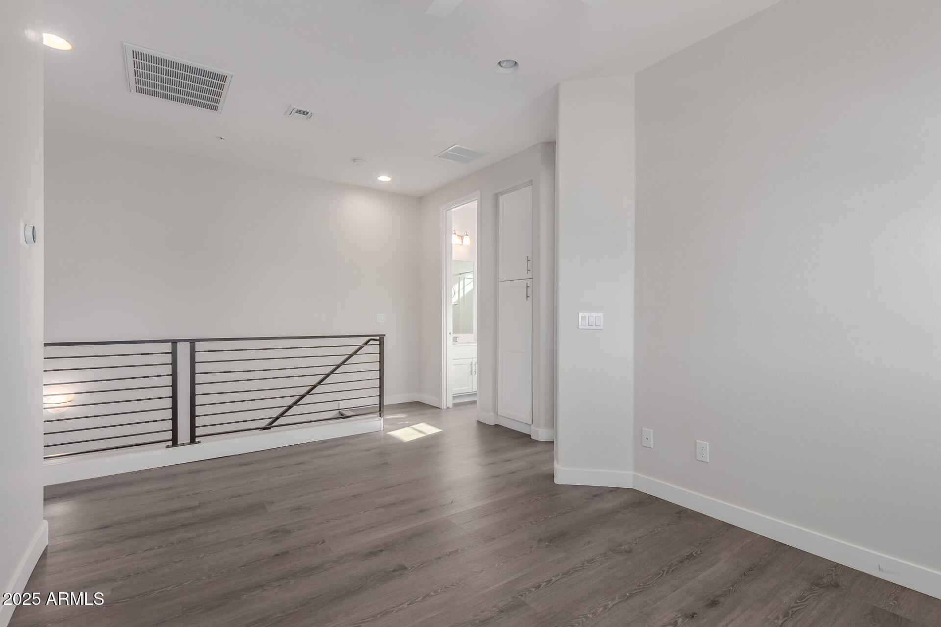4235 North 26th Street, Unit 1 Phoenix, AZ 85016 - Photo 36 of 62 a view of empty room with wooden floor