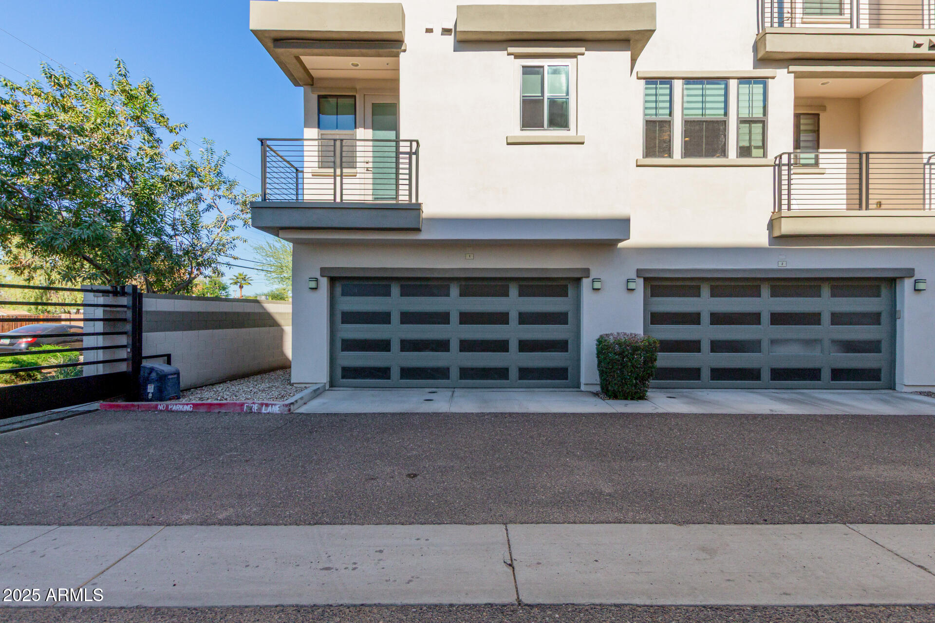 4235 North 26th Street, Unit 1 Phoenix, AZ 85016 - Photo 43 of 62 a front view of a house with a yard and garage