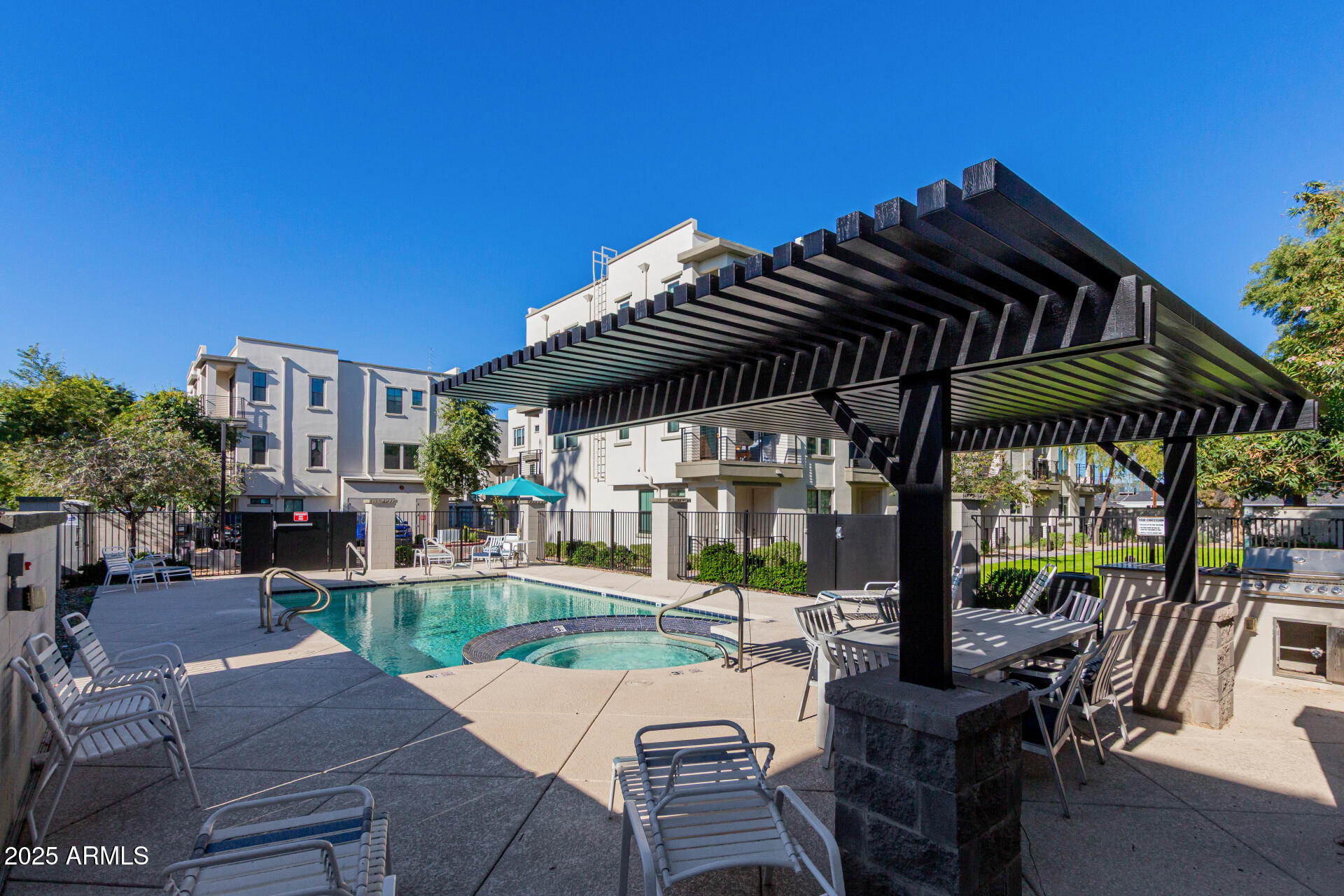4235 North 26th Street, Unit 1 Phoenix, AZ 85016 - Photo 49 of 62 a view of patio with table and chairs and potted plants