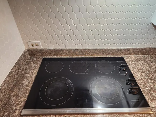 a bedroom with a bed and a mirror