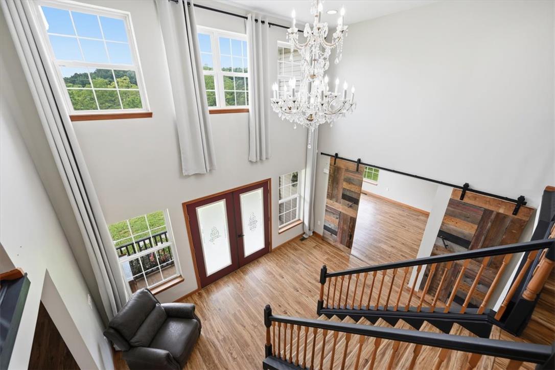 387 Blue Ridge Road Saylorsburg, PA 18353 - Photo 43 of 90 A grand entrance with high ceilings and a sparkling chandelier welcomes you.