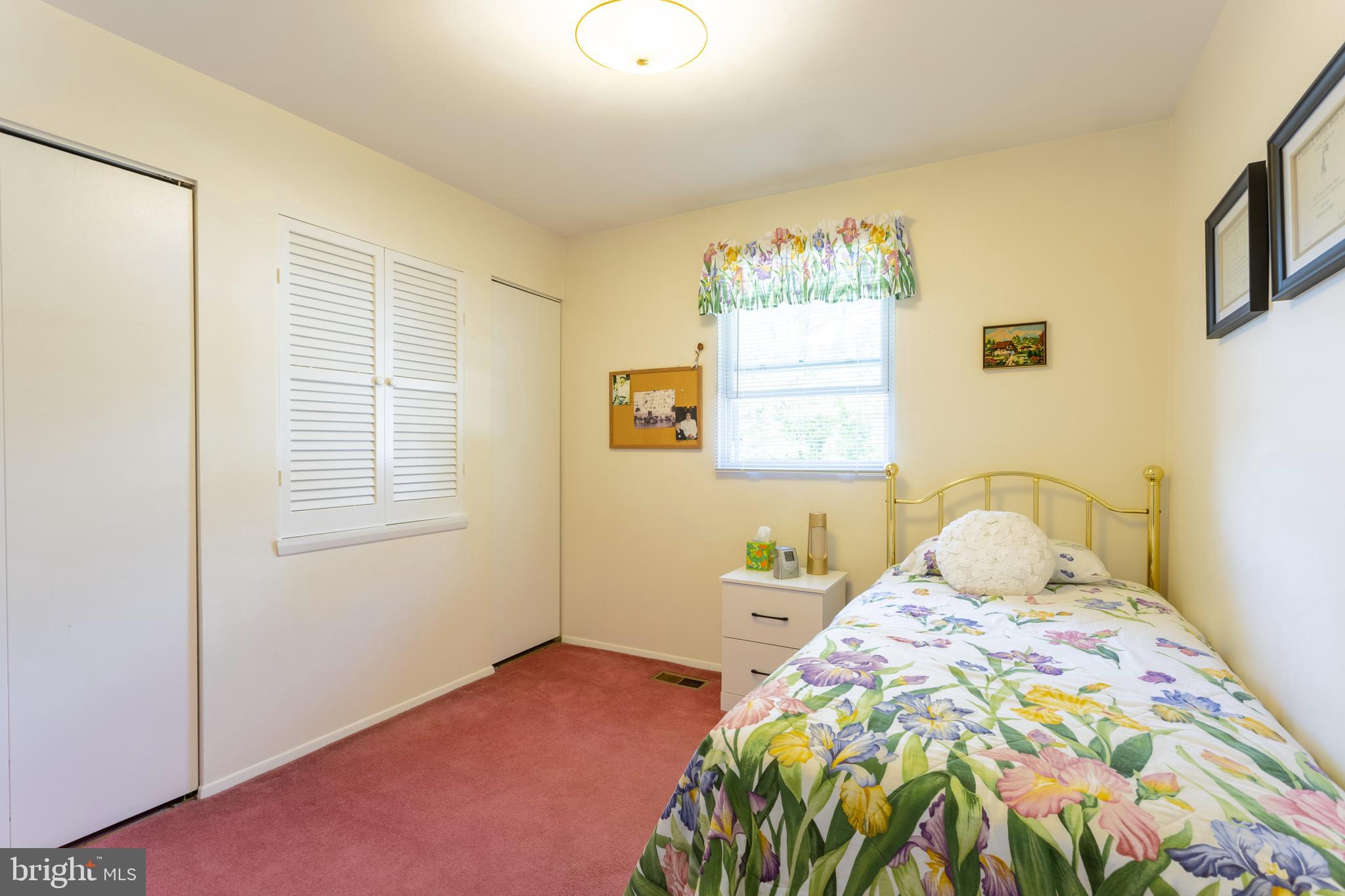 3313 Claran Road Baltimore, MD 21215 - Photo 19 of 35 a bedroom with a bed and a window