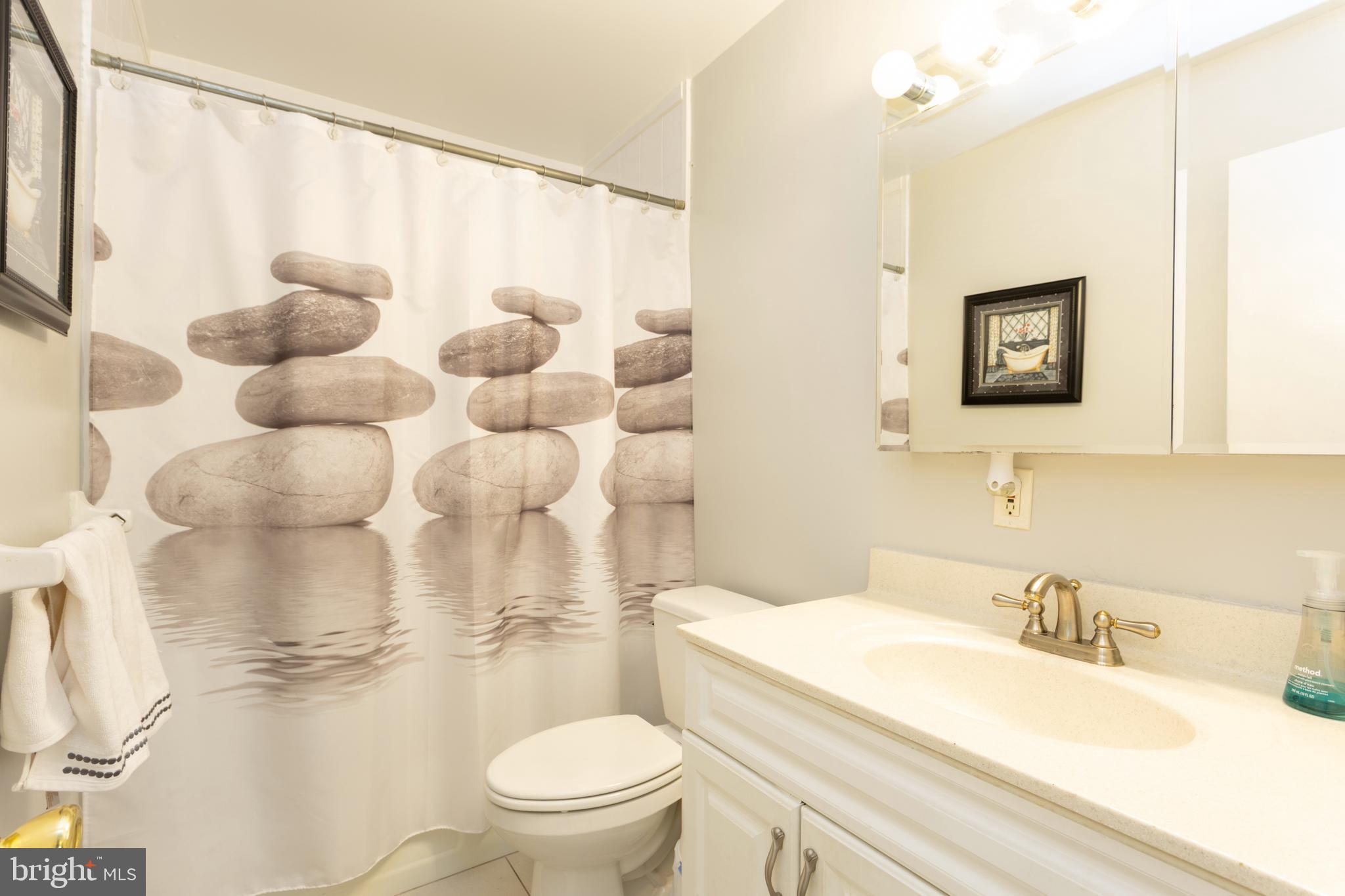 3313 Claran Road Baltimore, MD 21215 - Photo 20 of 35 a bathroom with a sink toilet and shower