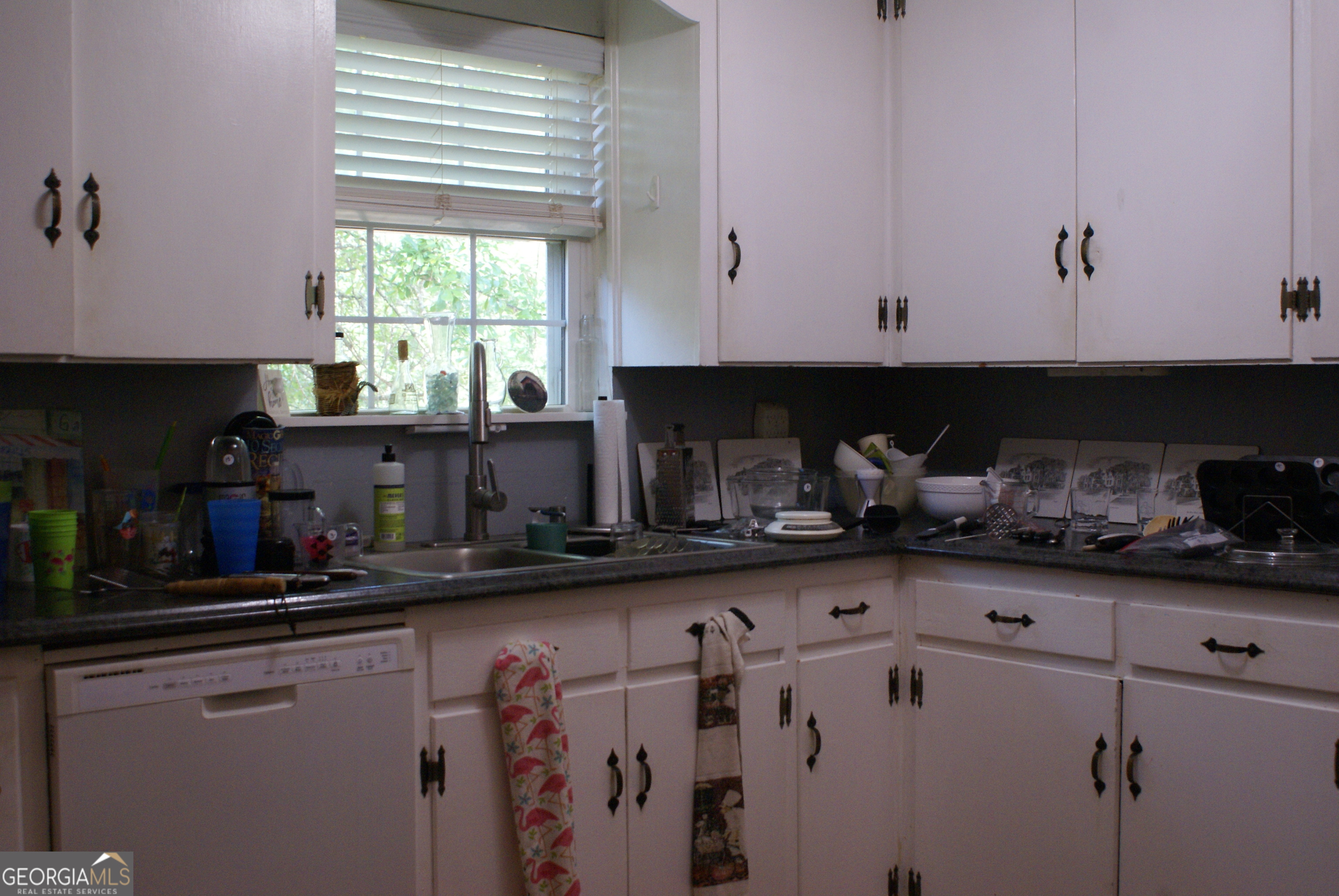 1591 Waymanville Road Thomaston, GA 30286 - Photo 7 of 24 a kitchen with stainless steel appliances a sink a stove and cabinets