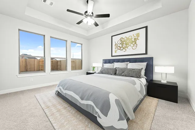 a bathroom with a double vanity sink mirror and a bathtub