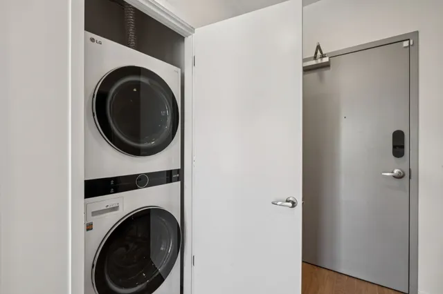 a view of a hallway with washer and dryer