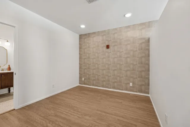 a view of a bathroom with wooden floor
