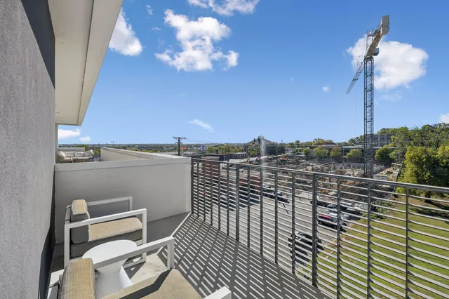 a view of a balcony with a chair