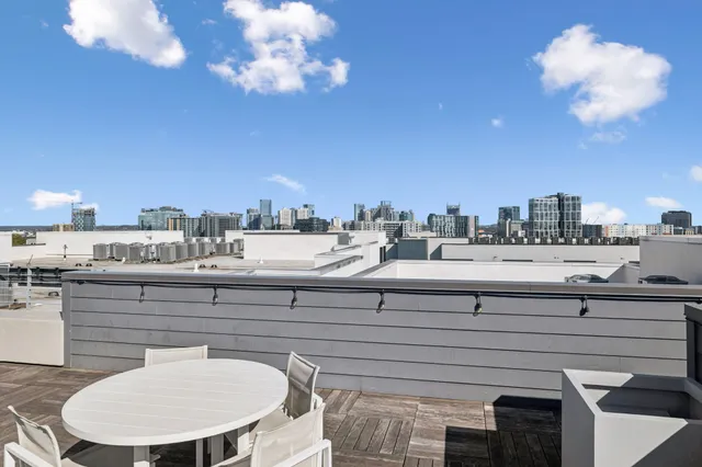 a room with a chandelier furniture and a large window