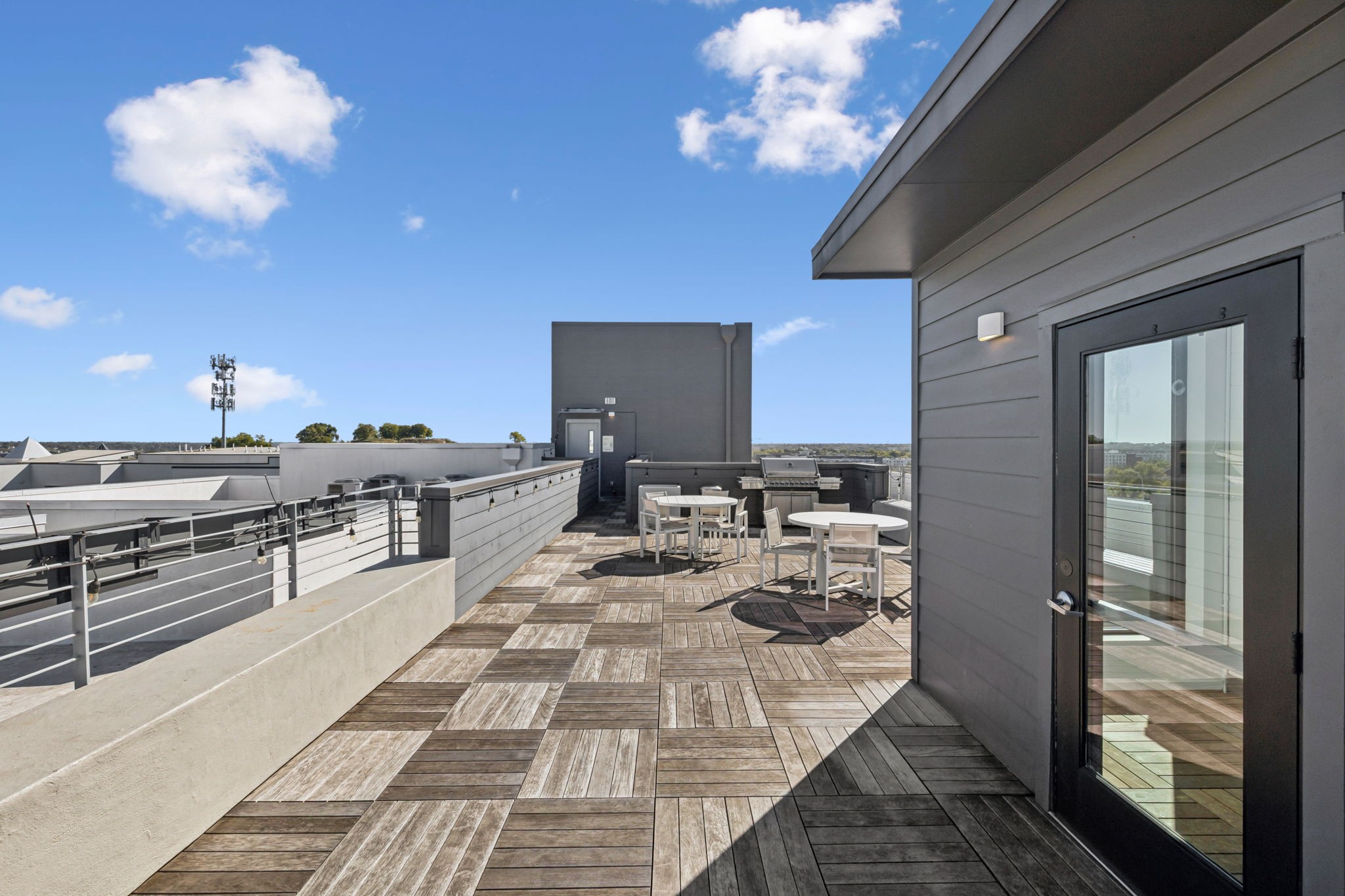 806 Olympic Street, Unit 407 Nashville, TN 37203 - Photo 25 of 28 a large kitchen with kitchen island stainless steel appliances a stove counter space a sink and cabinets