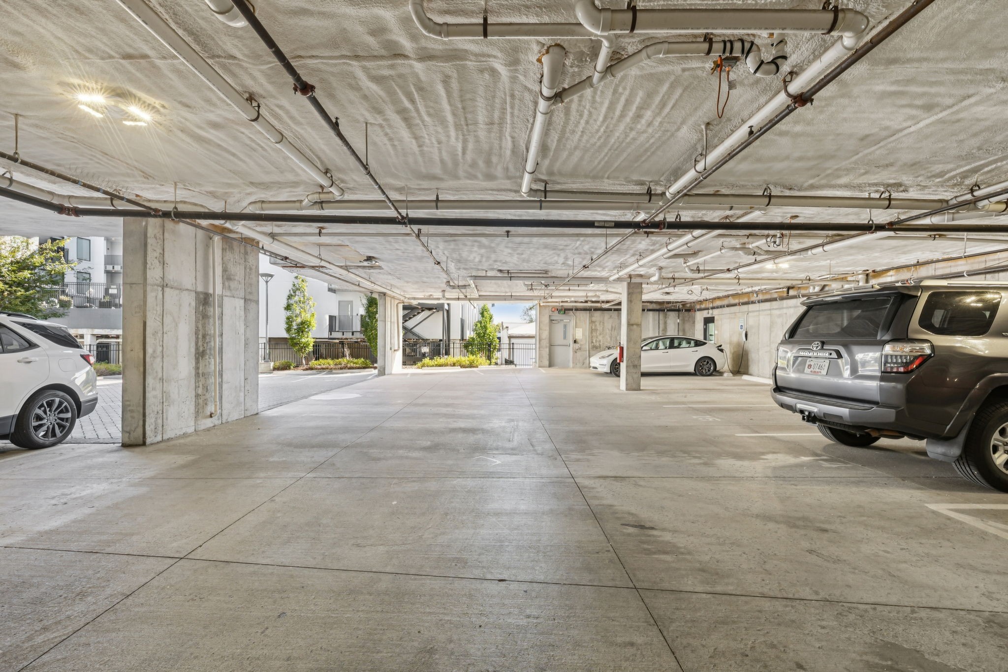806 Olympic Street, Unit 407 Nashville, TN 37203 - Photo 26 of 28 a view of parking garage with cars