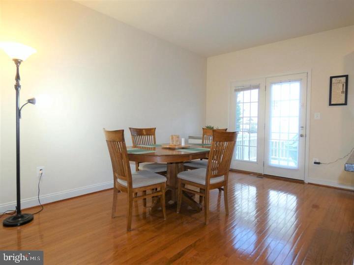 4911 Potomac Highlands Circle Triangle, VA 22172 - Photo 7 of 14 a dining room with furniture and wooden floor