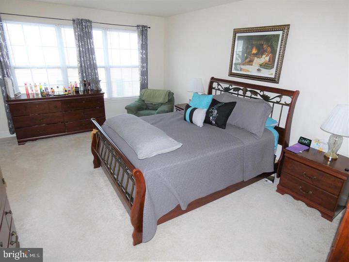 4911 Potomac Highlands Circle Triangle, VA 22172 - Photo 8 of 14 a bedroom with bed and a window