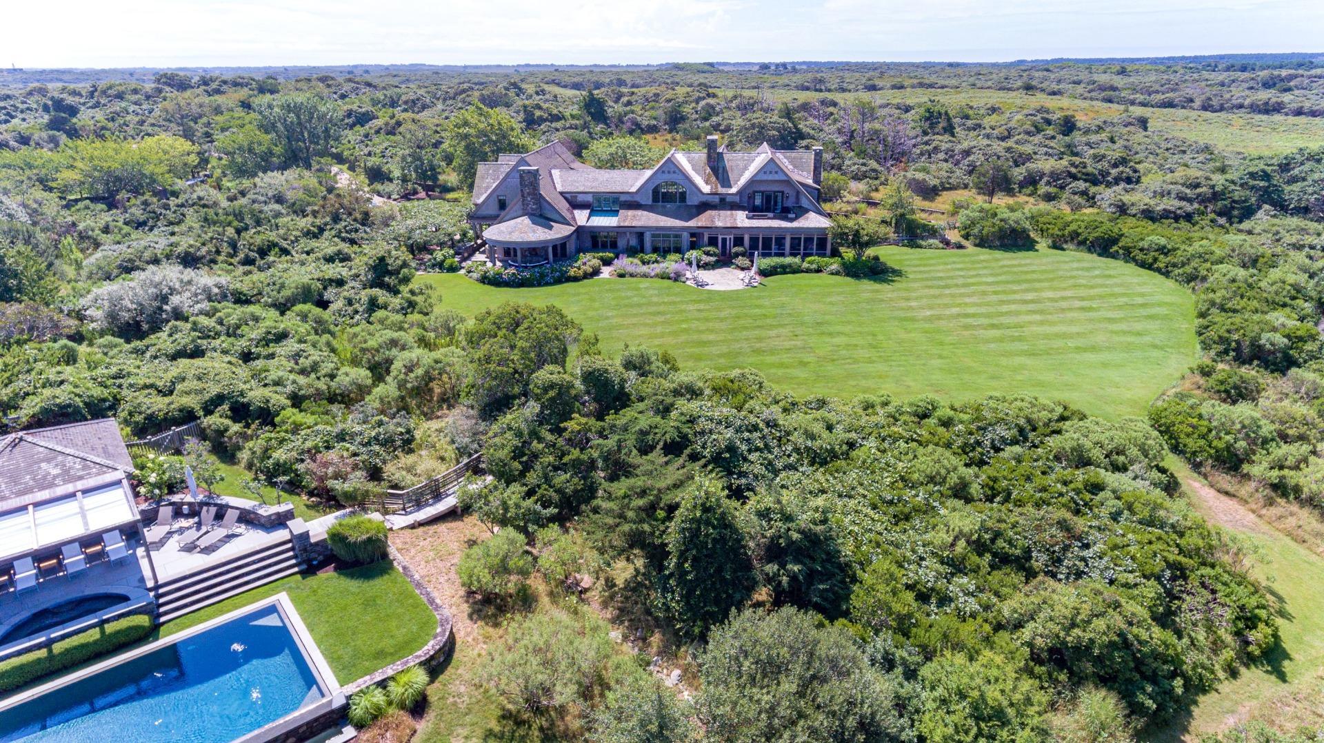 183 Polpis Road Nantucket, MA 02554 - Photo 55 of 62 an aerial view of a house with huge green field and large trees