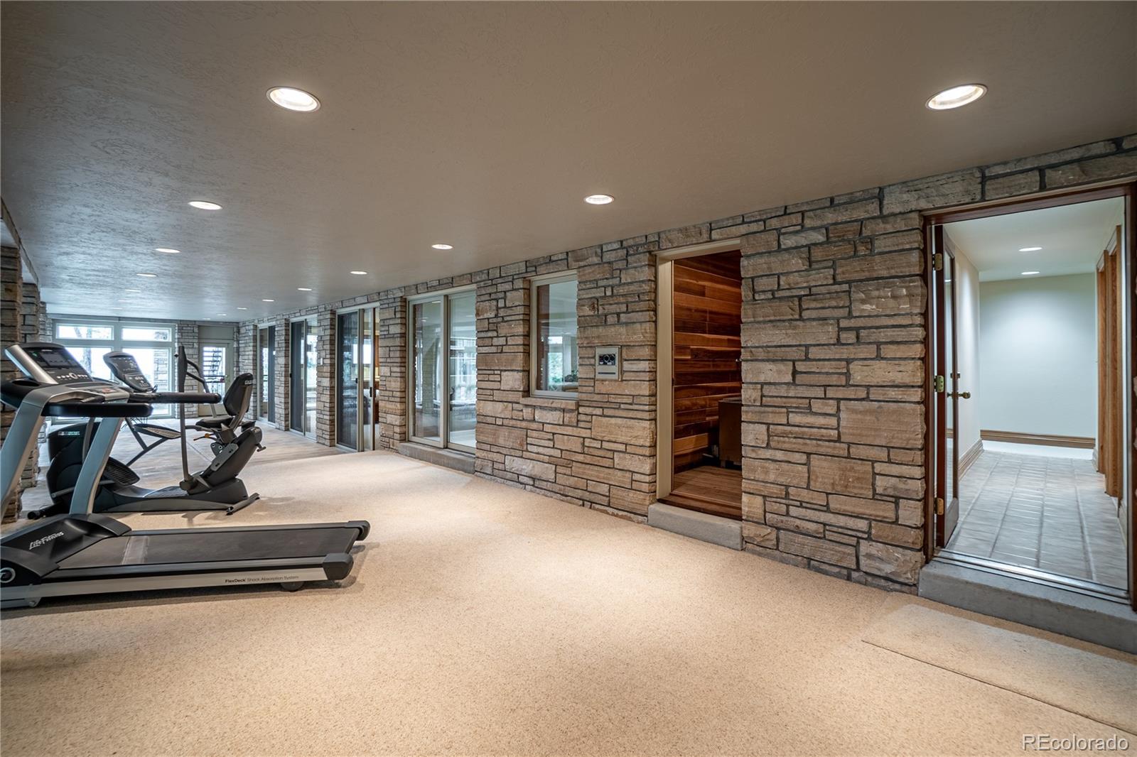 3282 Tomah Road Larkspur, CO 80118 - Photo 29 of 35 a view of a room with gym equipment