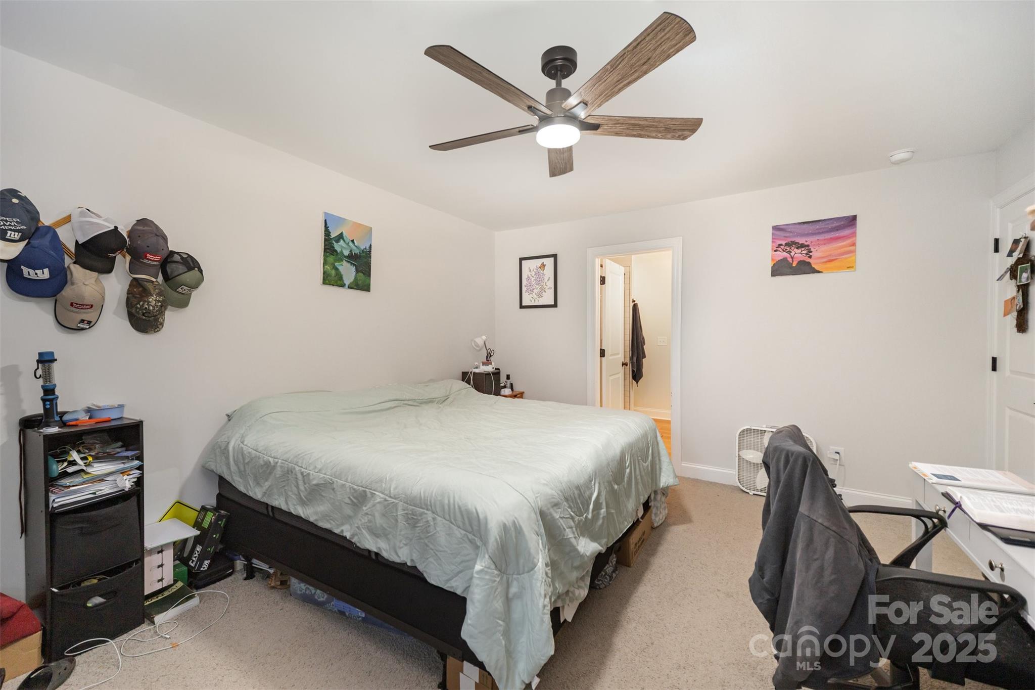 319 Pinnacle Road Kings Mountain, NC 28086 - Photo 13 of 22 a bedroom with a bed and a chandelier