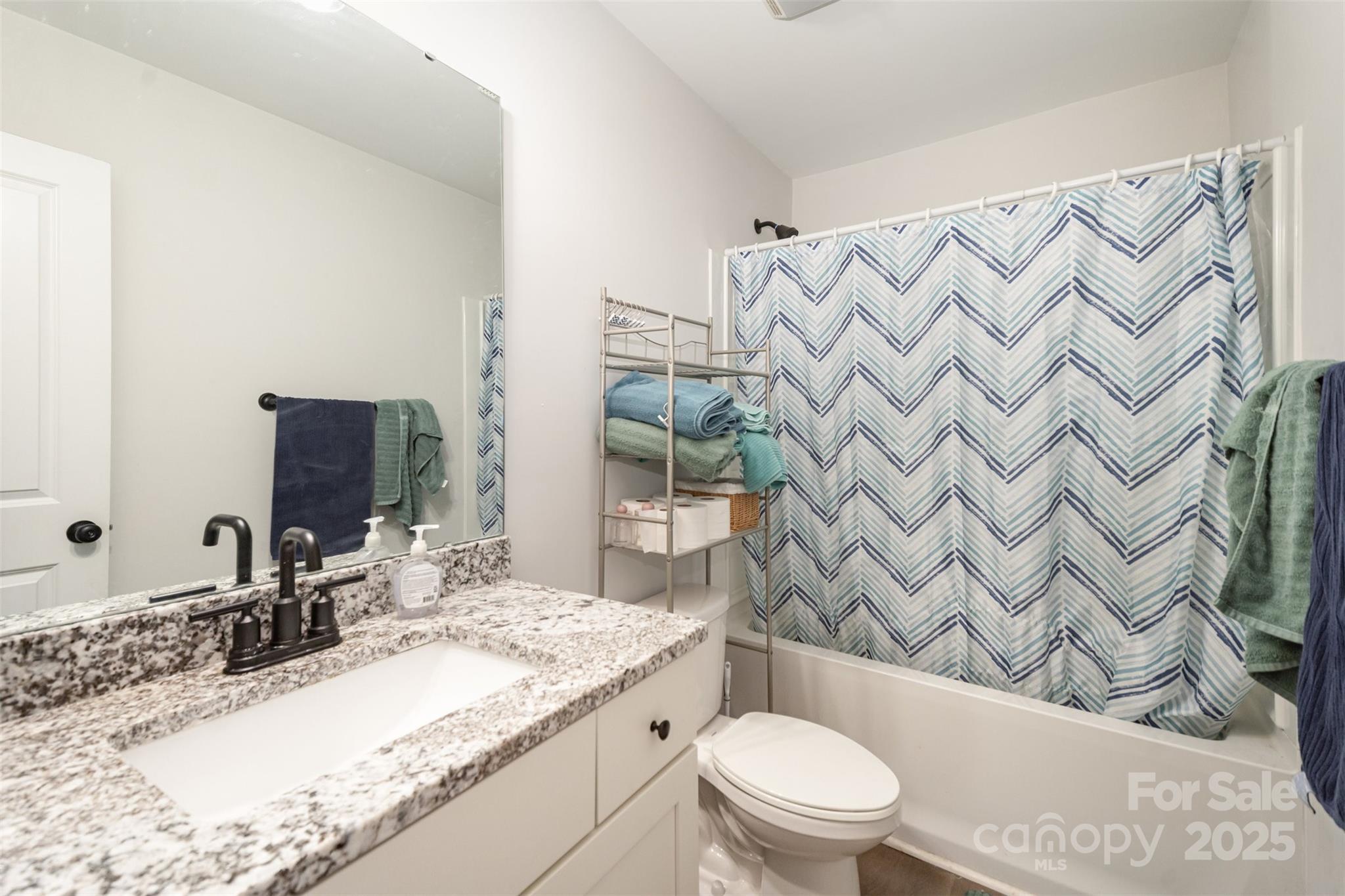319 Pinnacle Road Kings Mountain, NC 28086 - Photo 17 of 22 a bathroom with a granite countertop sink mirror vanity and toilet