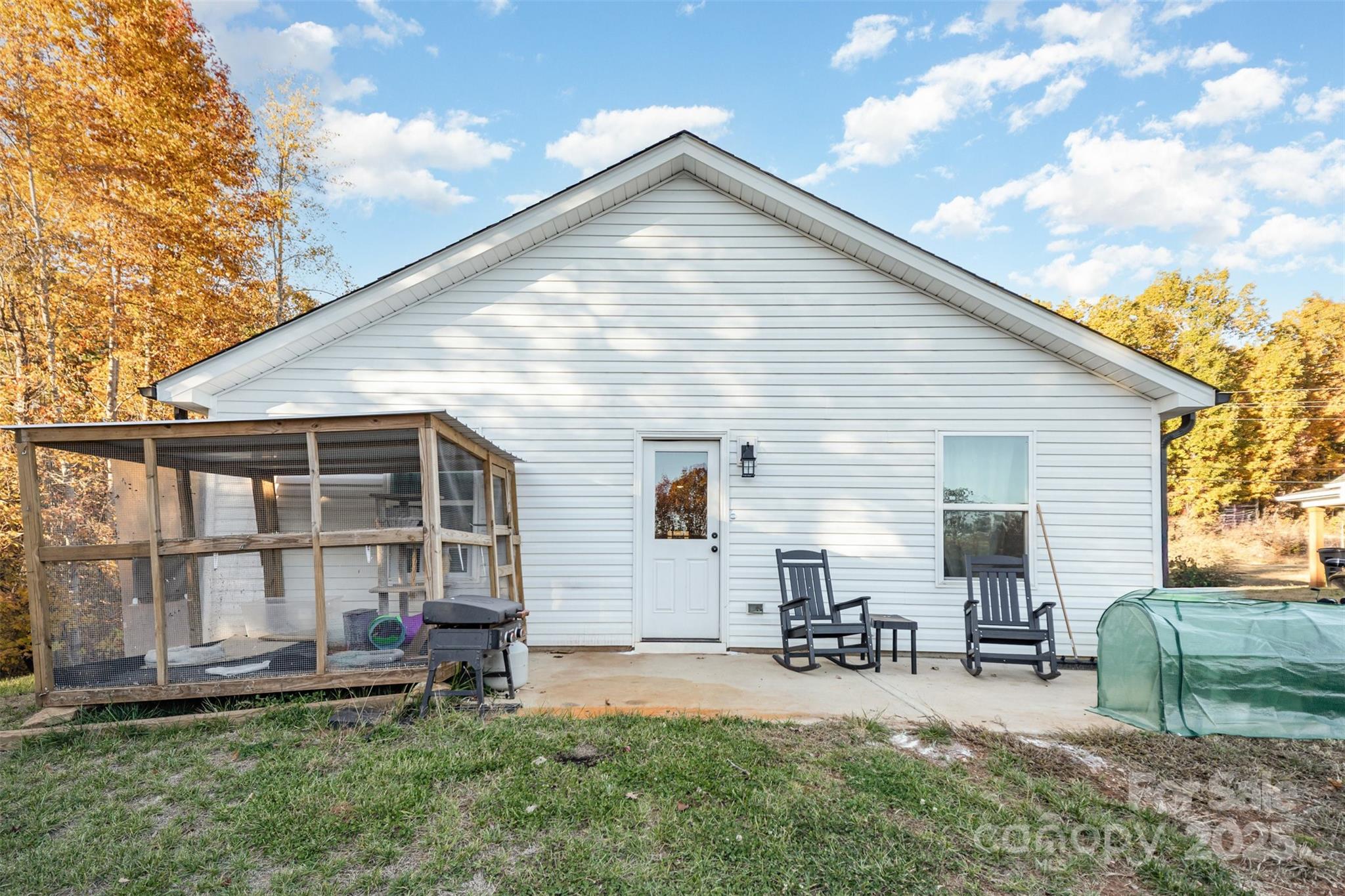 319 Pinnacle Road Kings Mountain, NC 28086 - Photo 19 of 22 a view of backyard of house with outdoor seating and covered with trees