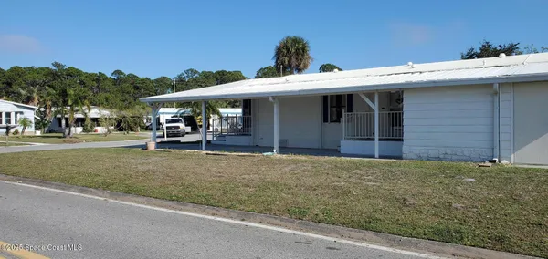 a view of a house with outdoor space and porch
