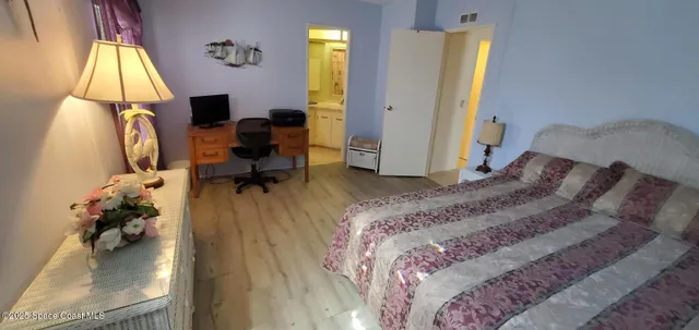 a bed room with a bed and a window