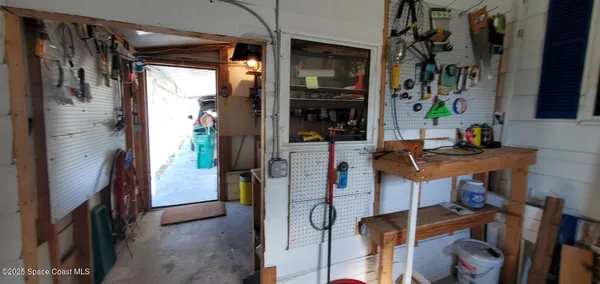 a room with furniture and a potted plant