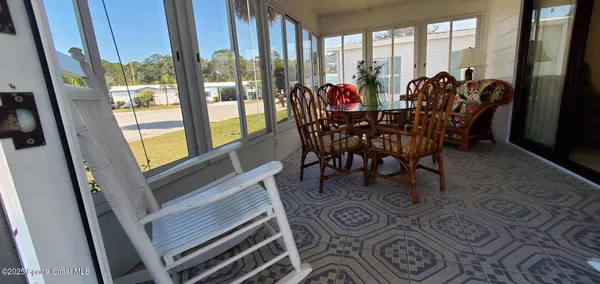 a view of a dining room with furniture window and outside view