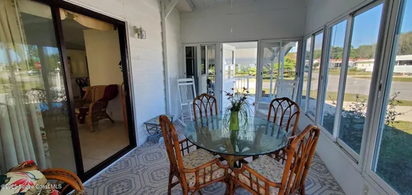 a view of a dining room with furniture window and outside view