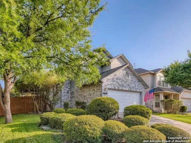 a view of house with yard