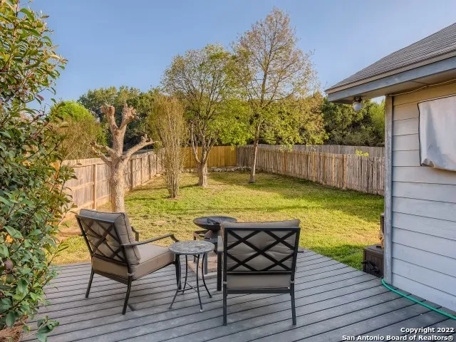 a view of a swimming pool with chair and table