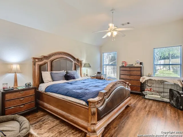 a bedroom with bed and window