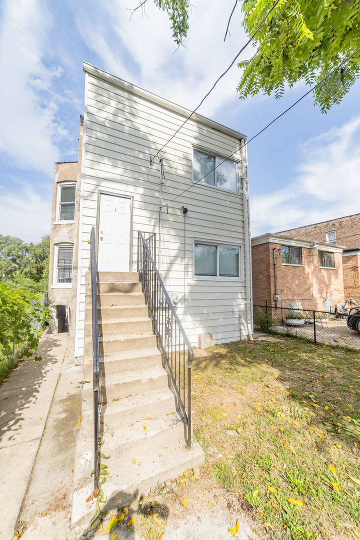 1229 East 71st Street Chicago, IL 60619 - Photo 14 of 14 a view of a house with a outdoor space