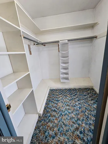 a bed room with a bed and a television