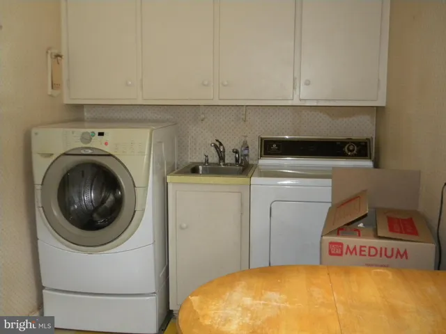 a utility room with dryer and washer