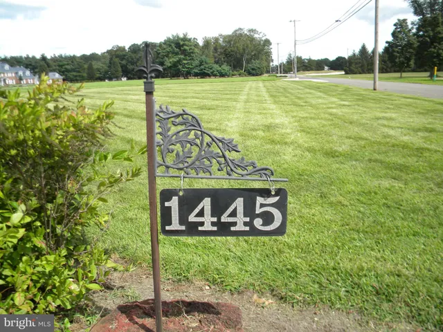 a view of a street with a sign board