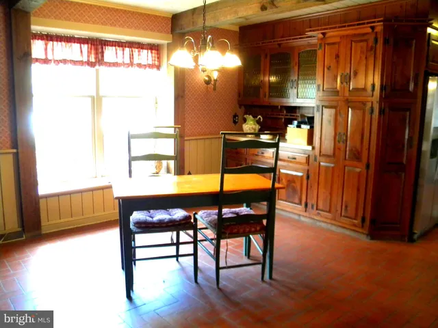 a view of a livingroom with furniture window and wooden floor