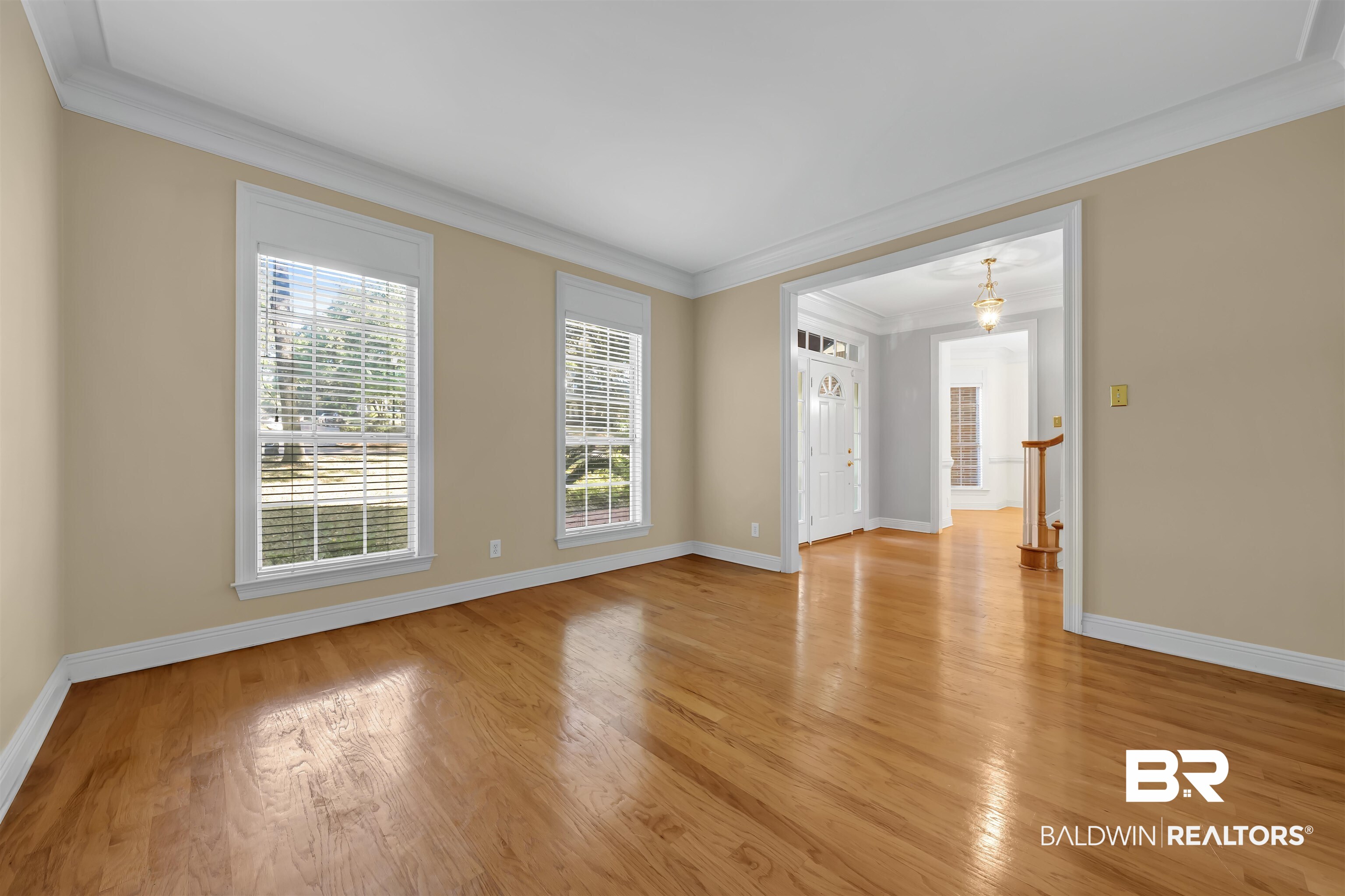 1262 Patrick Street Daphne, AL 36526 - Photo 5 of 35 Unfurnished room with crown molding and light wood-style flooring