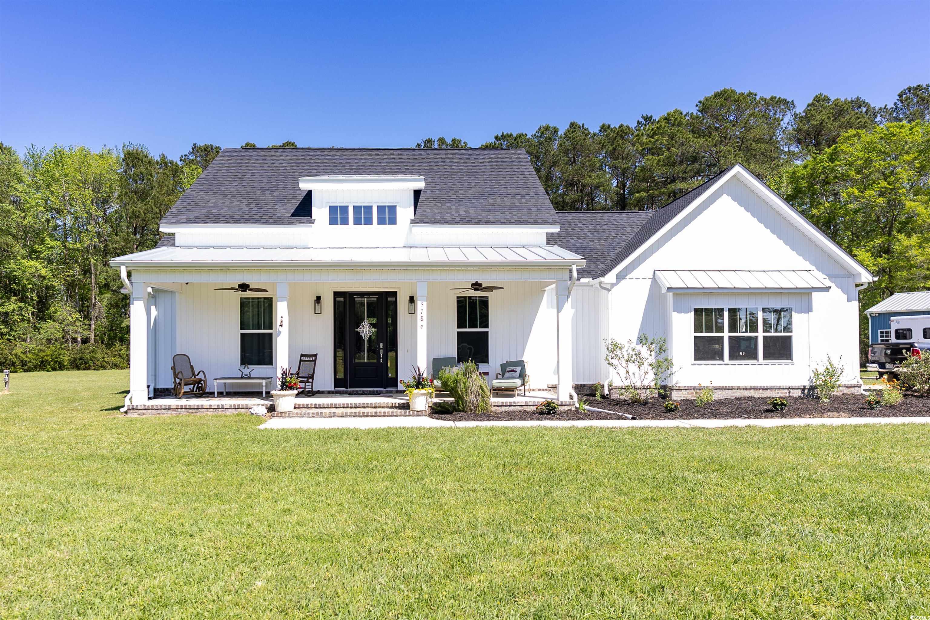 5786 Tranquil Road Conway, SC 29527 - Photo 1 of 36 Modern inspired farmhouse featuring metal roof, a