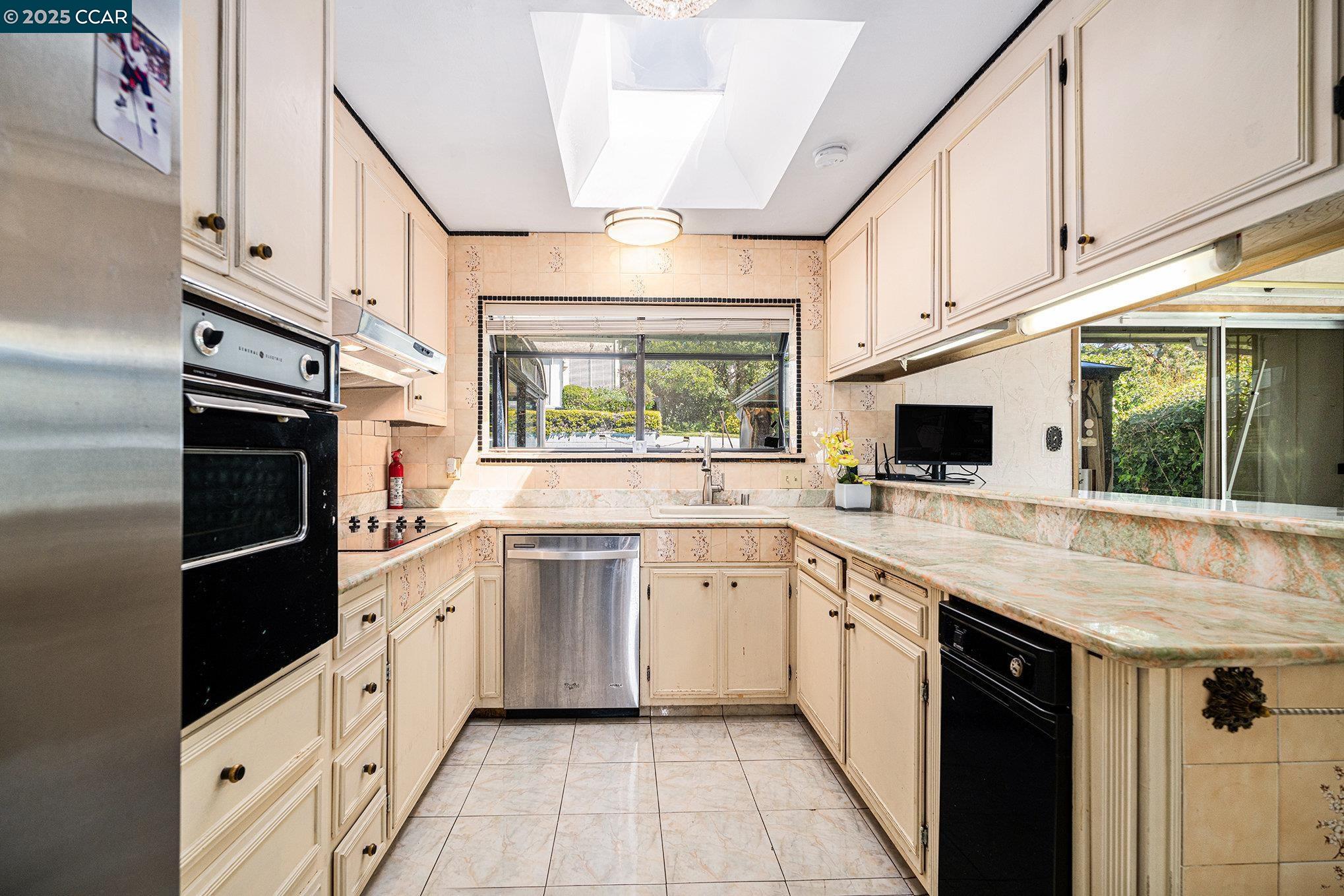 5955 Ralston Avenue Richmond, CA 94805 - Photo 11 of 47 a kitchen with white cabinets and appliances