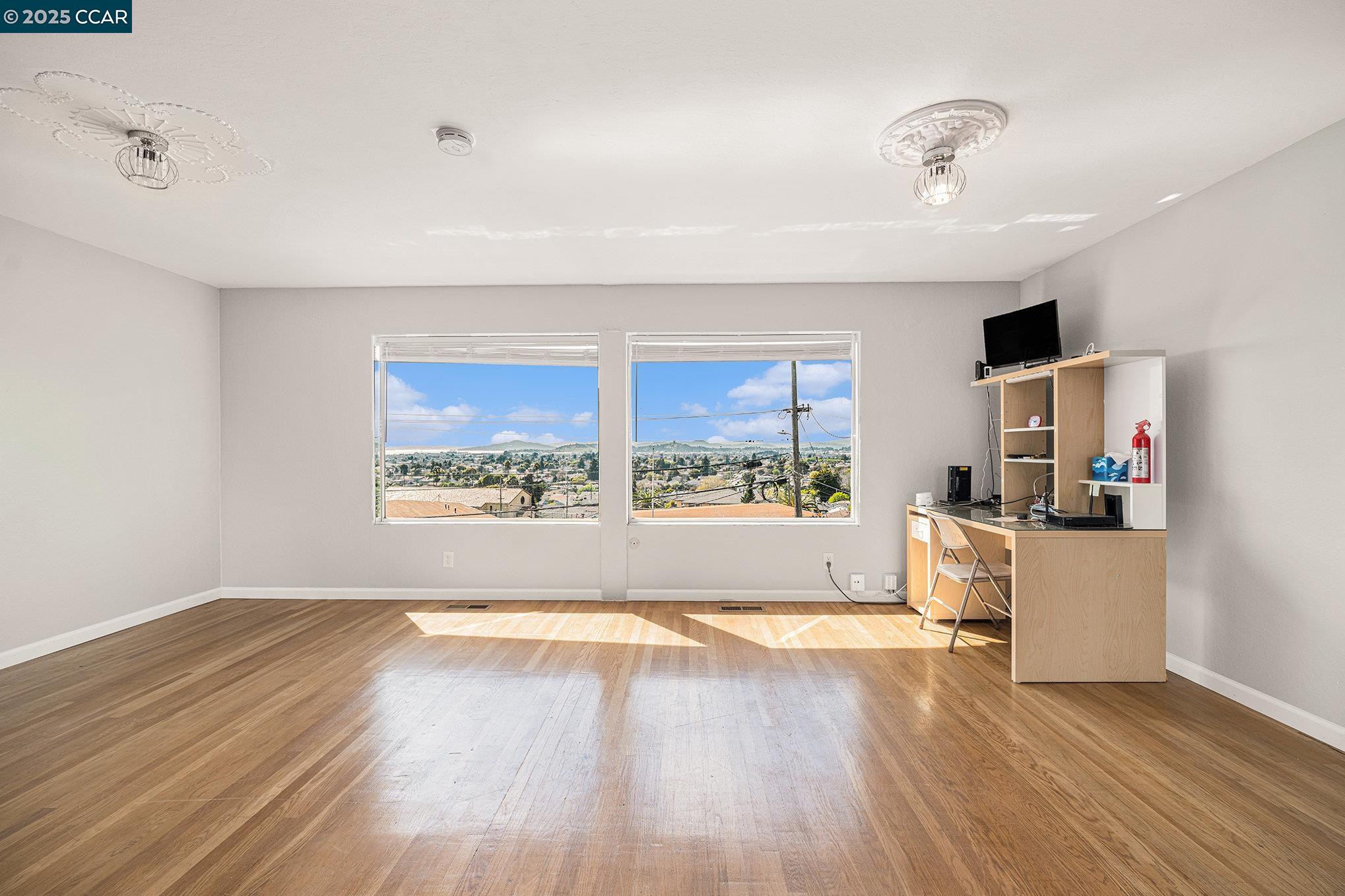 5955 Ralston Avenue Richmond, CA 94805 - Photo 13 of 47 a view of a kitchen with flat screen tv and a window