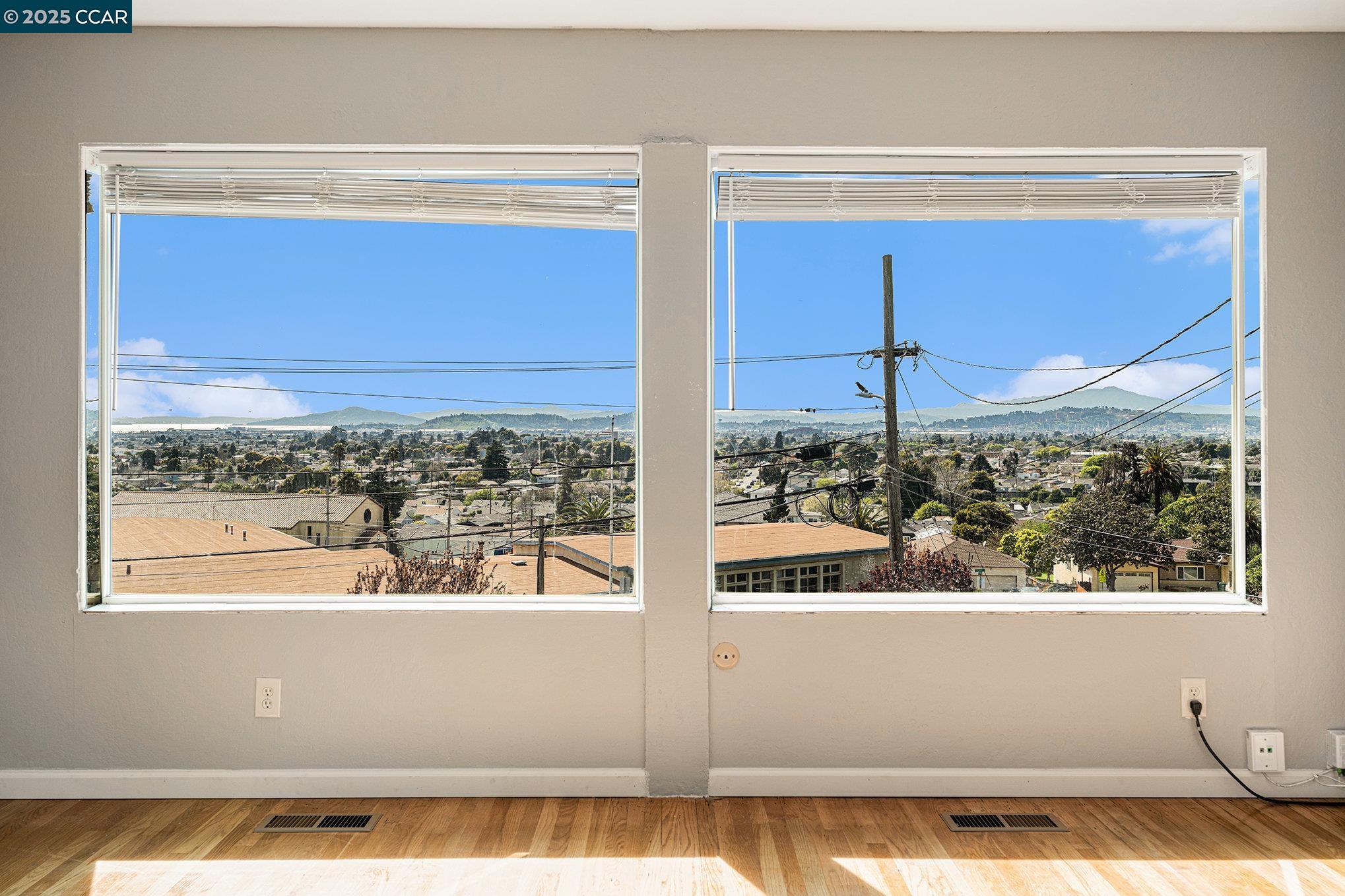 5955 Ralston Avenue Richmond, CA 94805 - Photo 14 of 47 a view of a glass door with a view of the back yard