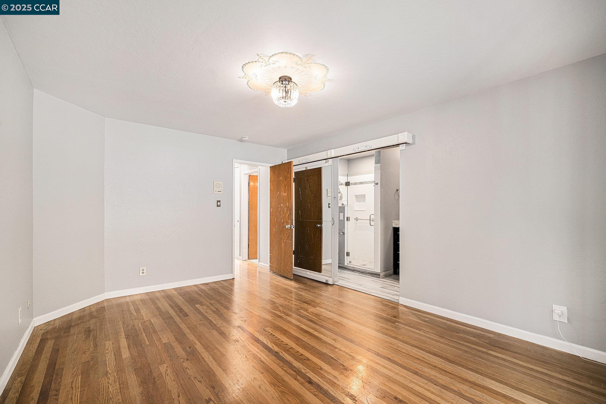 5955 Ralston Avenue Richmond, CA 94805 - Photo 22 of 47 a view of an empty room with wooden floor