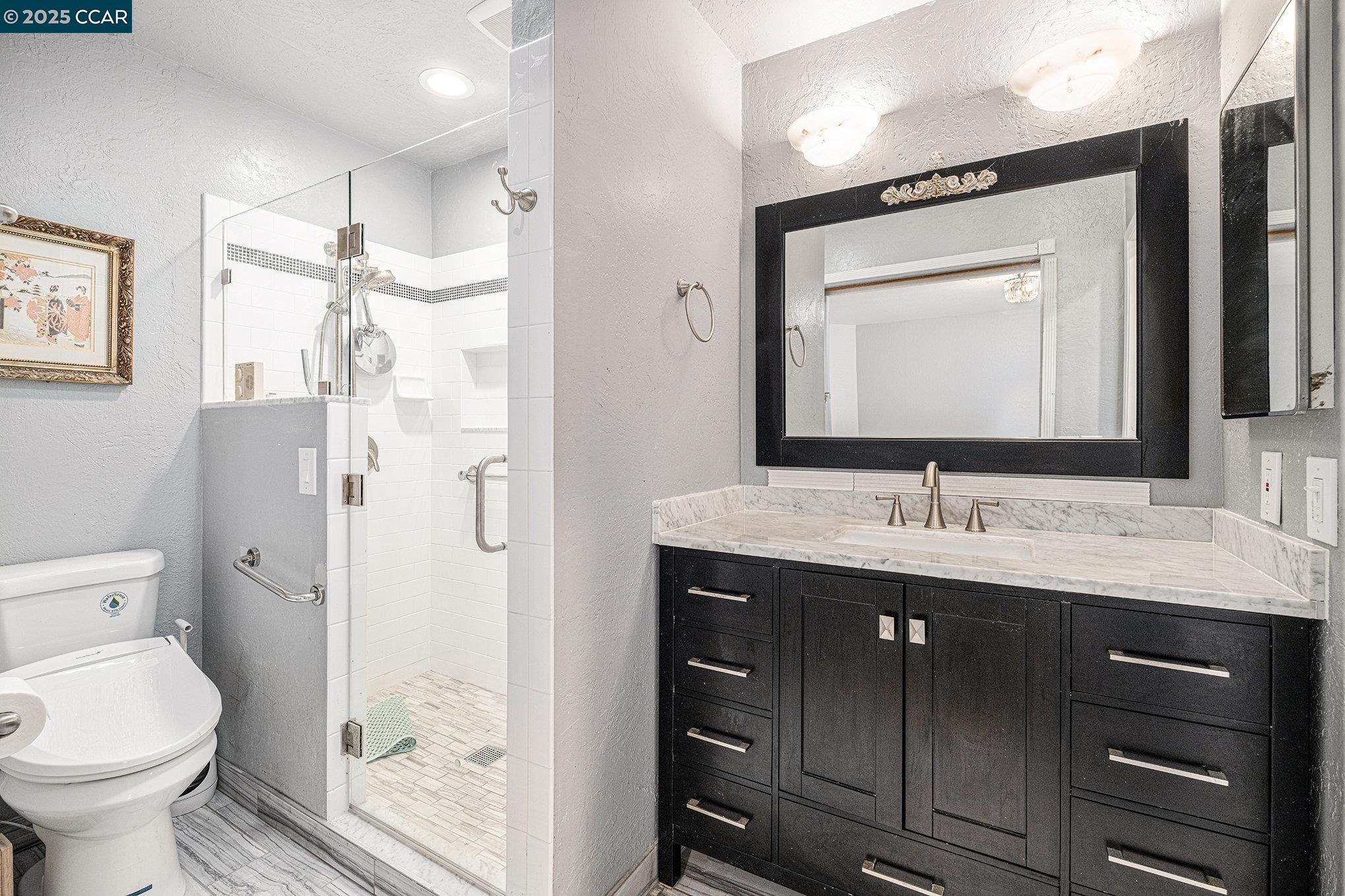 5955 Ralston Avenue Richmond, CA 94805 - Photo 25 of 47 a bathroom with a toilet sink and shower