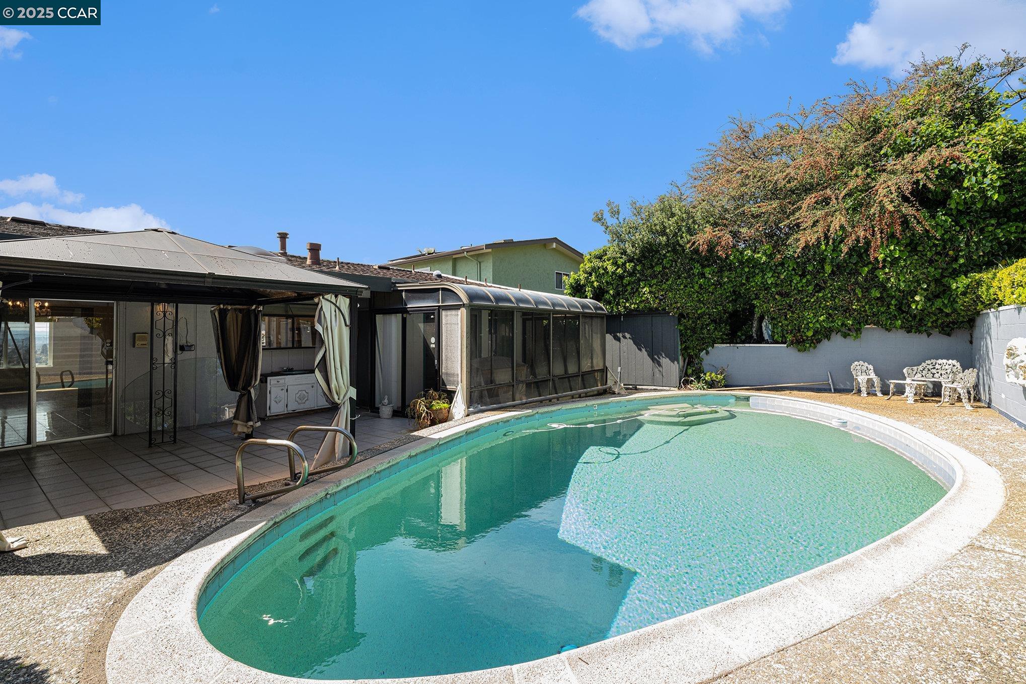 5955 Ralston Avenue Richmond, CA 94805 - Photo 37 of 47 a view of a house with swimming pool and sitting area