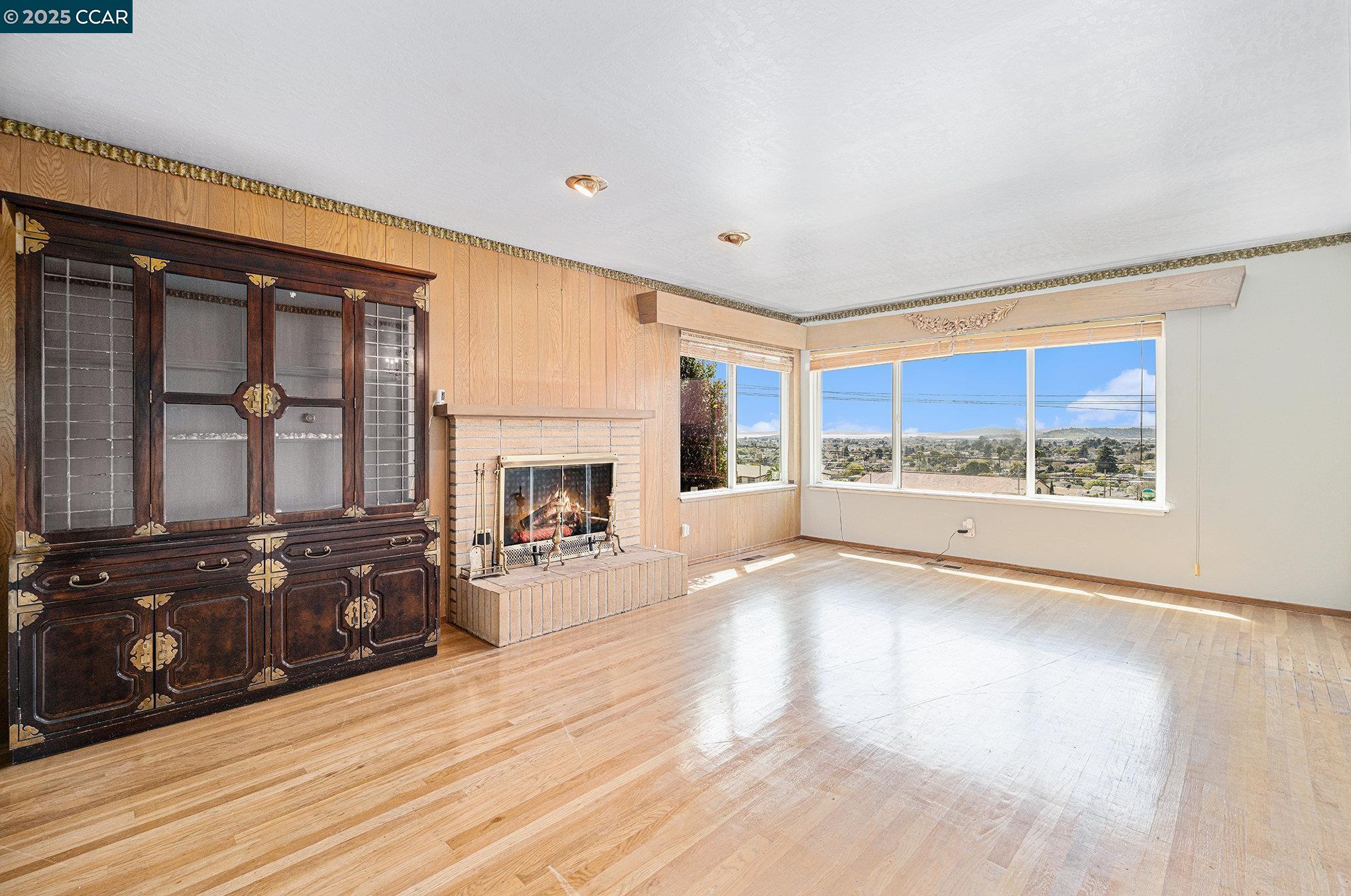 5955 Ralston Avenue Richmond, CA 94805 - Photo 4 of 47 a view of a fireplace and window in the room