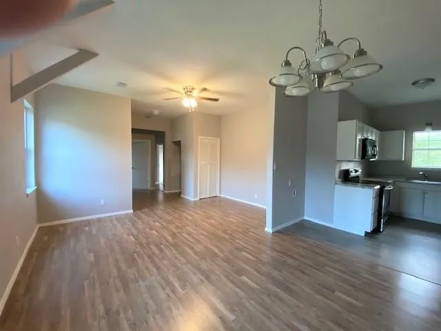 a view of a livingroom with a kitchen